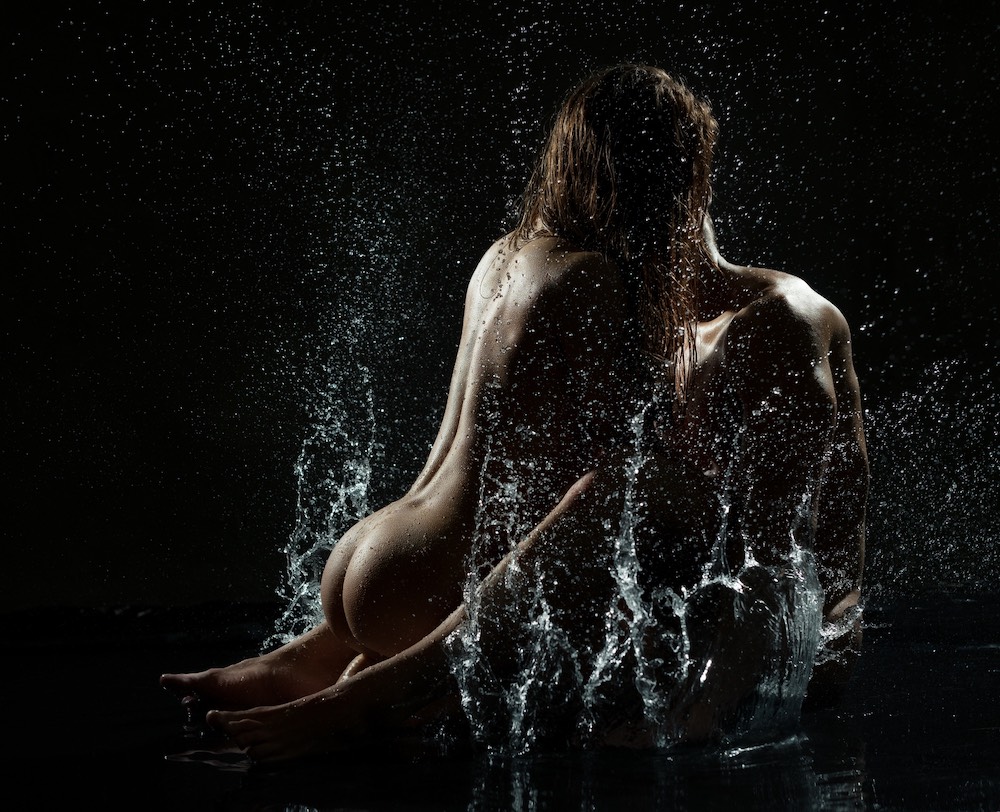 Gorgeous couple nude in aqua zone studio shot